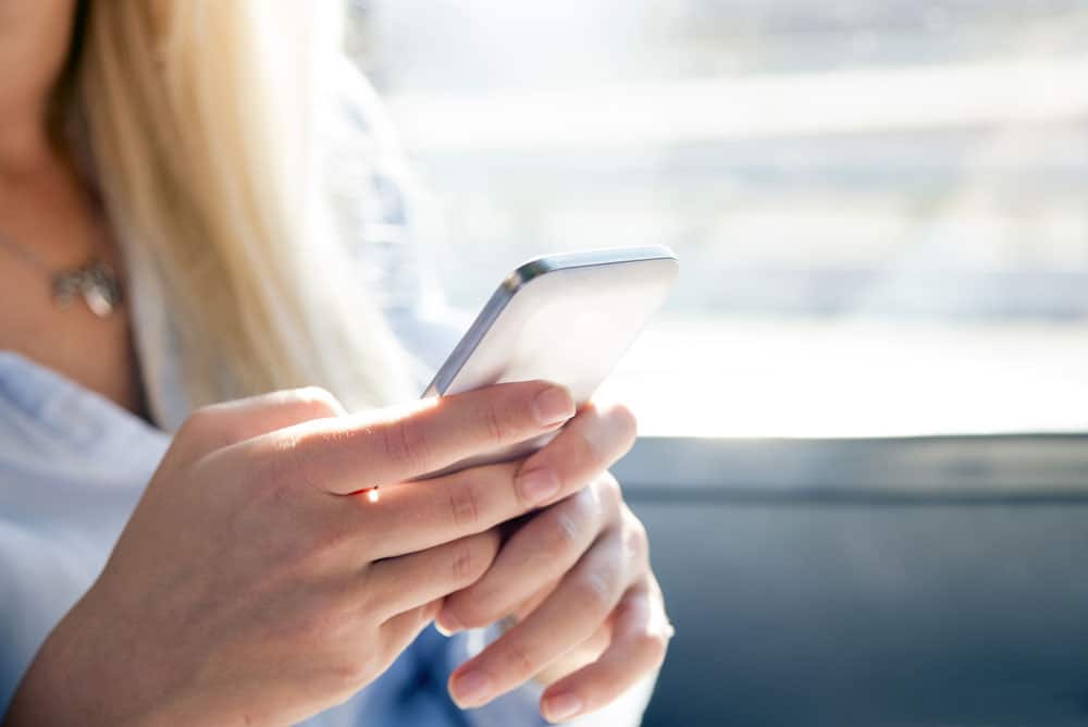 Woman-texting-with-her-smartphone-for-Web