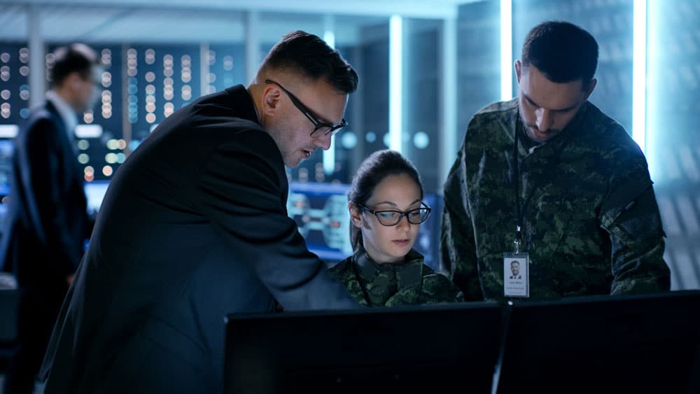 3 people working at an operations center